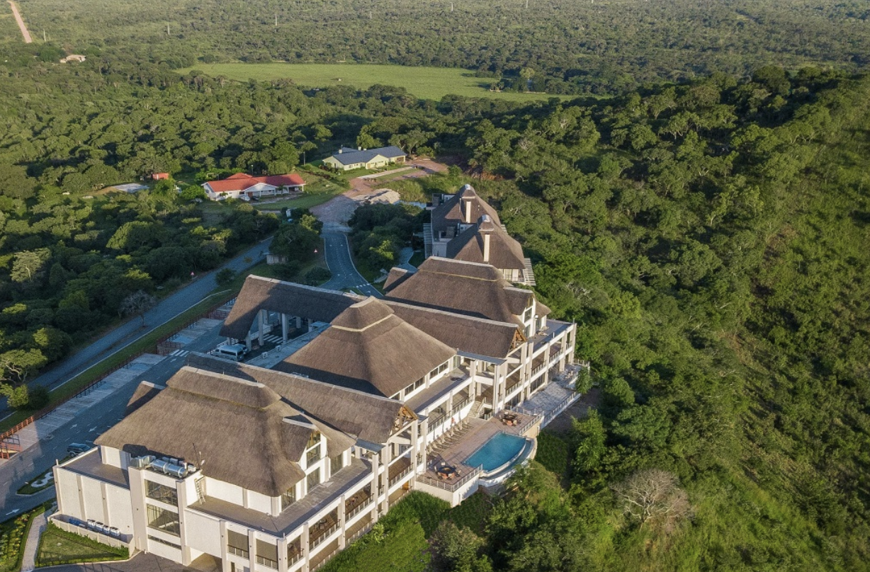 Aerial view of Lusaka Legacy Resort surrounded by woodland