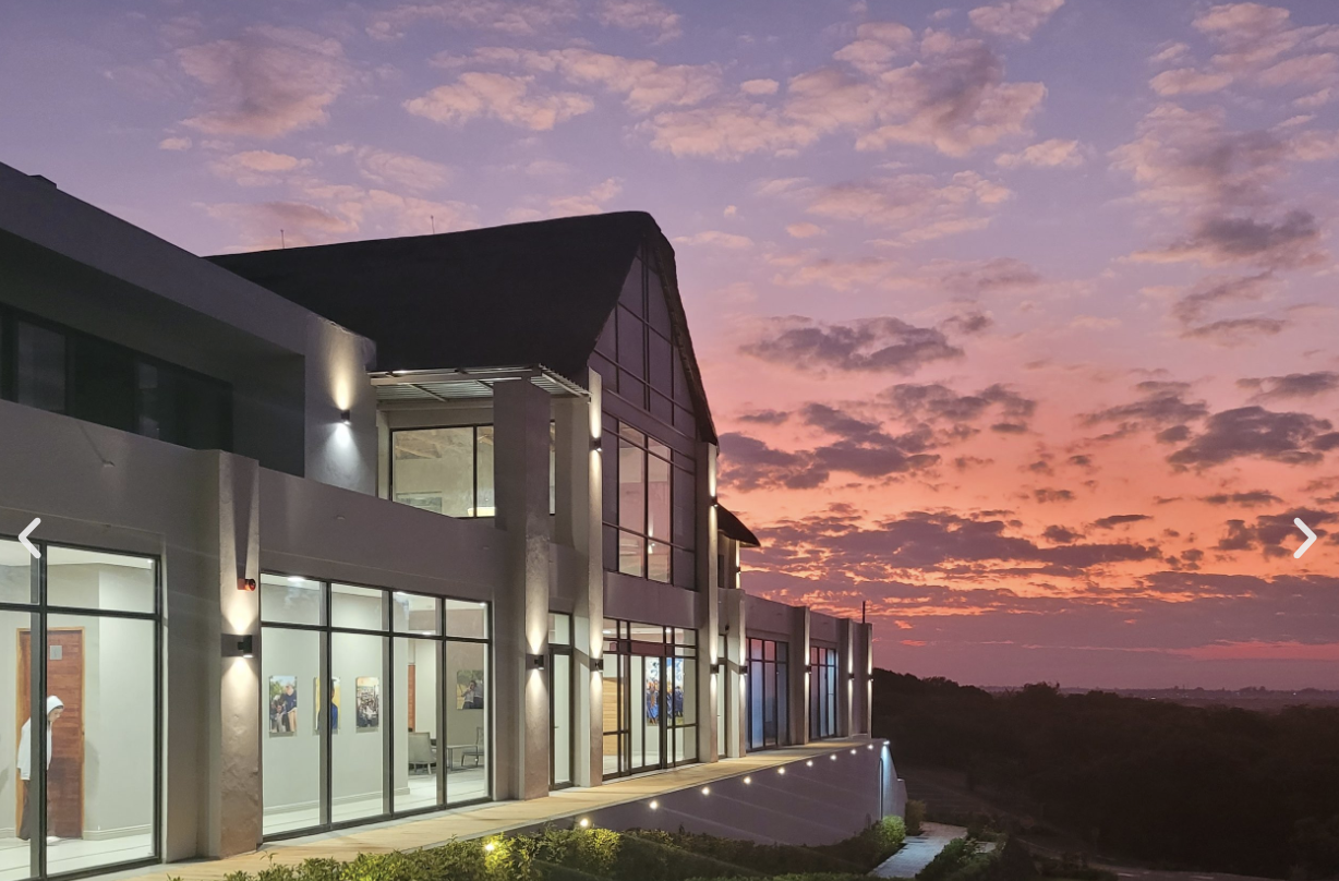 Lusaka Legacy Resort exterior at sunset